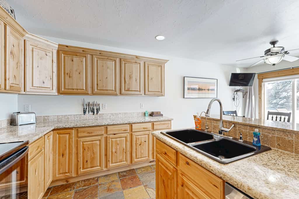 Right in the heart of McCall, this bright Aspen Village townhome puts the best of the area within easy reach. Walk to Payette Lake, downtown restaurants, coffee shops, and nearby parks, then come home to enjoy resort-style community amenities including indoor and outdoor pools, a hot tub, sauna, fitness center, and sports courts. With a cozy fireplace, private patio, and family-friendly layout, it’s an easy home base for relaxing mountain getaways in every season.