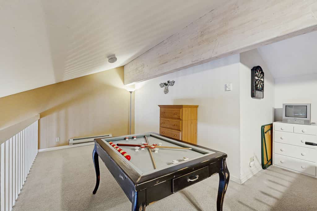 Located in Aspen Village, two-level condo gives you access to pools, hot tub, sauna, gym, and courts, along with a layout that works well for families or groups. Two queen bedrooms with ensuite bathrooms are on the main level, and the upstairs loft offers a futon, bumper pool, foosball, and games for added space and entertainment.