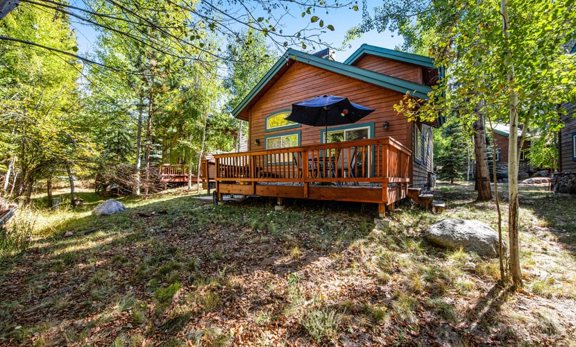 A cozy 3-bedroom cabin in the Spring Mountain Ranch community, offering the classic McCall cabin feel with modern decor and finishes that feel like home. Features a wood burning fireplace, inviting living spaces, and a private deck with outdoor dining. Enjoy access to community amenities including a pool, hot tub, fitness center, sauna, and courts.