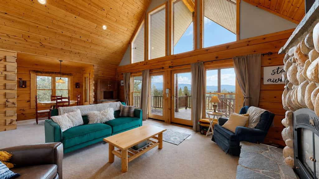 Mountain retreat located at MeadowCreek Golf Resort with soaring windows, a stone fireplace, and sweeping Idaho mountain views. This cozy getaway offers two sleeping areas, a loft overlooking the main living space, access to resort pool and golf amenities, and a peaceful setting close to year-round outdoor recreation.