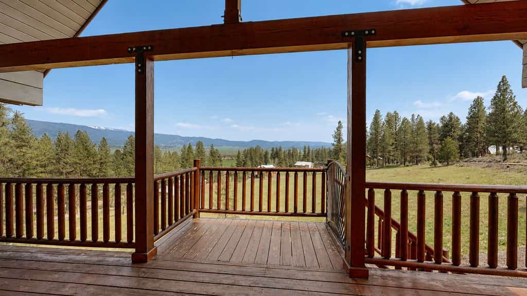 Mountain retreat located at MeadowCreek Golf Resort with soaring windows, a stone fireplace, and sweeping Idaho mountain views. This cozy getaway offers two sleeping areas, a loft overlooking the main living space, access to resort pool and golf amenities, and a peaceful setting close to year-round outdoor recreation.