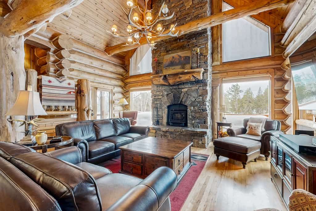 A custom-built log cabin surrounded by aspens with sweeping countryside views, a private hot tub, and a lodge-style great room. Featuring a gourmet kitchen, stone fireplace, covered patio, loft sleeping area, and game space in the garage, this mountain retreat offers a peaceful setting with room for families and small groups to relax year-round.