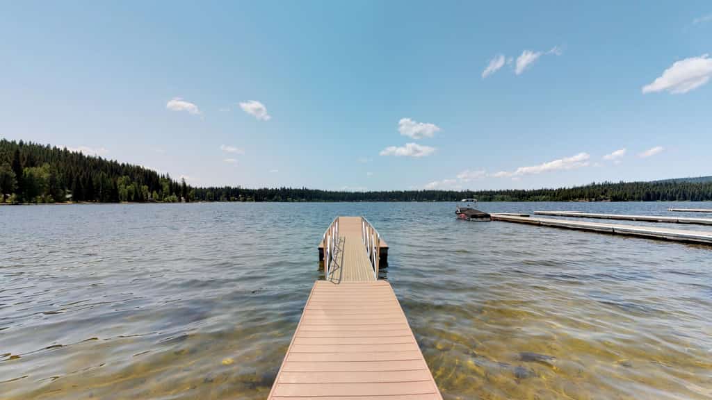 Classic lakefront cabin with a private dock, large deck, and direct access to Payette Lake. This nostalgic McCall retreat combines cozy cabin charm with beautiful lake views, updated beds, and an unbeatable waterfront setting just steps from the water.