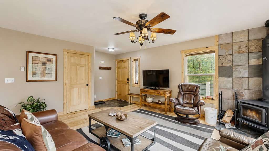A secluded mountain retreat, located in the MeadowCreek Golf Resort, surrounded by trees and designed for quiet getaways in every season. Large picture windows, a wraparound deck, and multiple outdoor gathering spaces create an easy connection to nature, while the game room, wood stove, and updated kitchen make relaxing at home just as enjoyable.