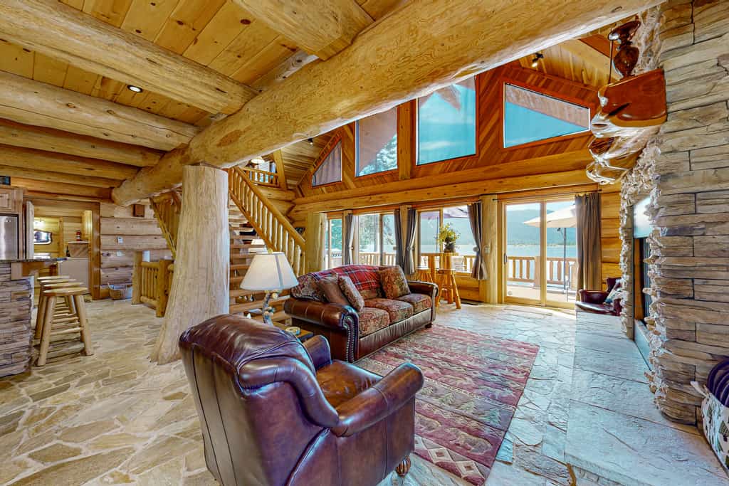 A stunning waterfront log cabin on Lake Cascade with a private dock, expansive deck, and incredible views across the lake to Tamarack Resort. Designed for memorable group getaways, this three-level retreat features a grand stone fireplace, multiple game areas, lakefront outdoor living, and flexible sleeping spaces for families and friends to gather year-round.