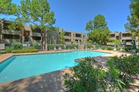 Stylish updated condo with balcony, pool, & hot tub - near golf and greenway