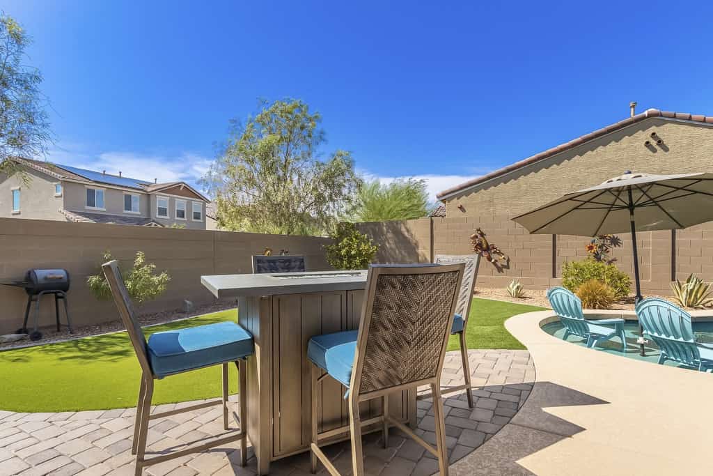 Airy desert home with an enclosed yard, private pool, hot tub, firepit, & W/D