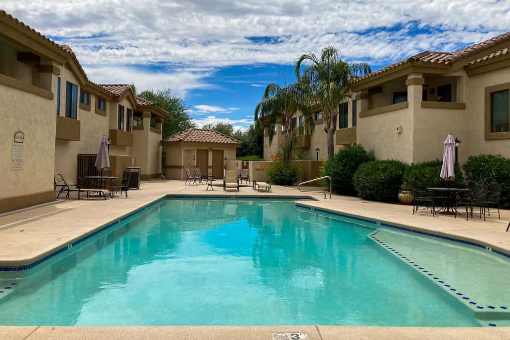 Dog-friendly mountain view condo with pool, gym, grill, fireplace, & sunroom
