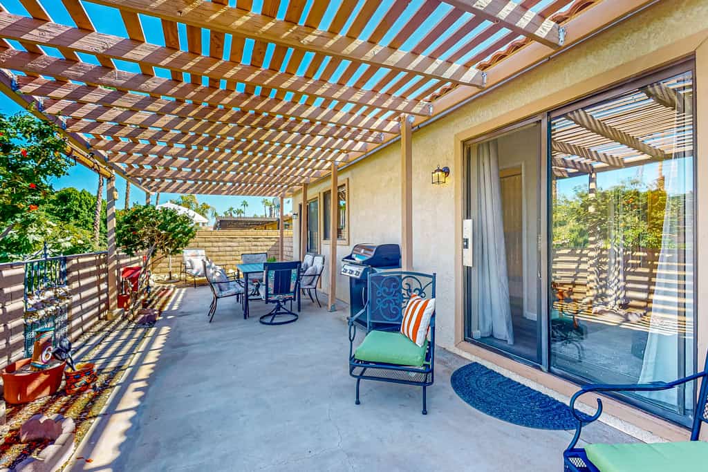 Gated community home with 2 pools, hot tubs, private patio, AC, & W/D