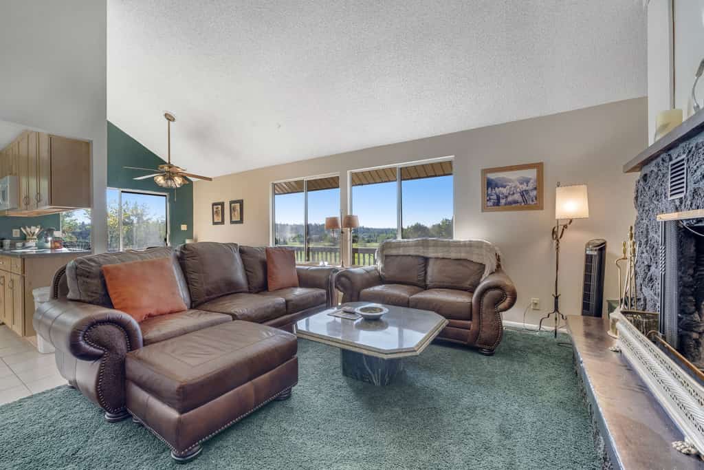 Refined home with a game room, balcony, grill, washer/dryer, & four bedrooms