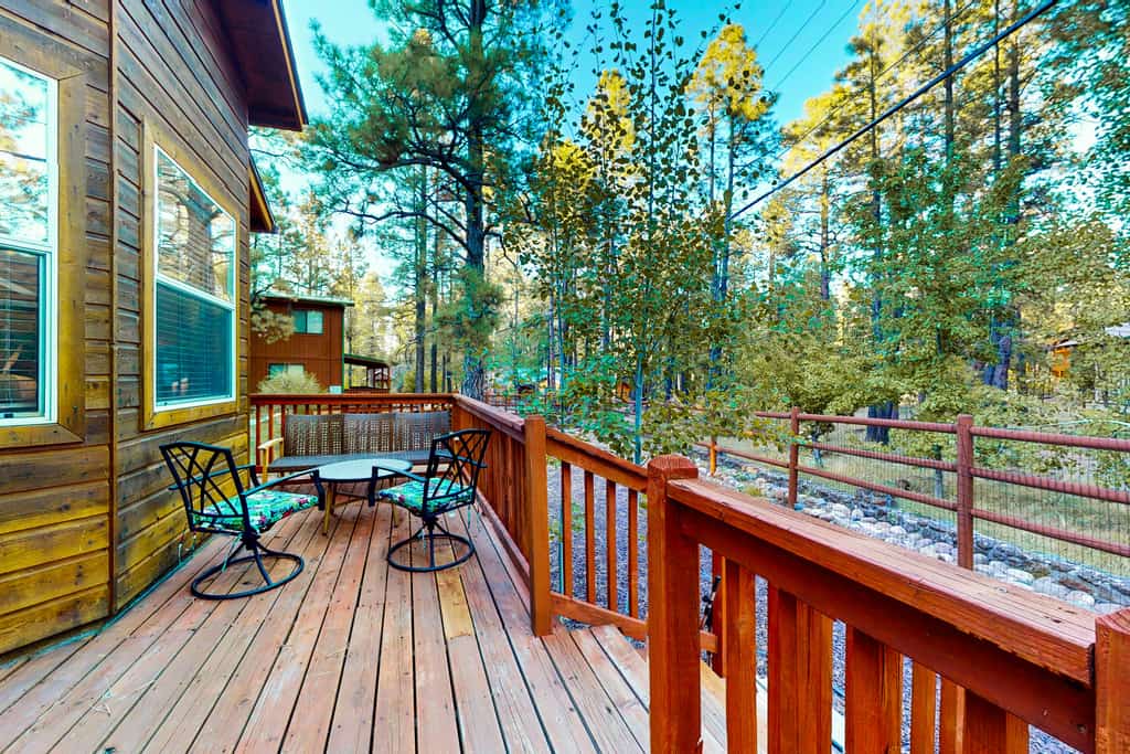 Dog-friendly forested home with wraparound deck, pool table