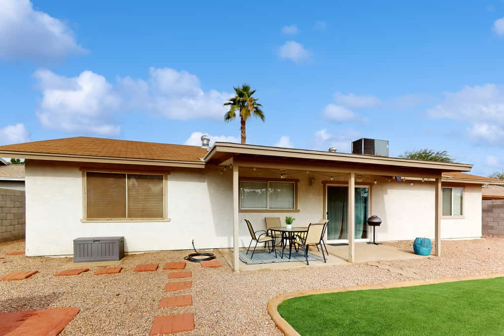 Single-level vacation home with fenced yard, furnished patio, & washer/dryer