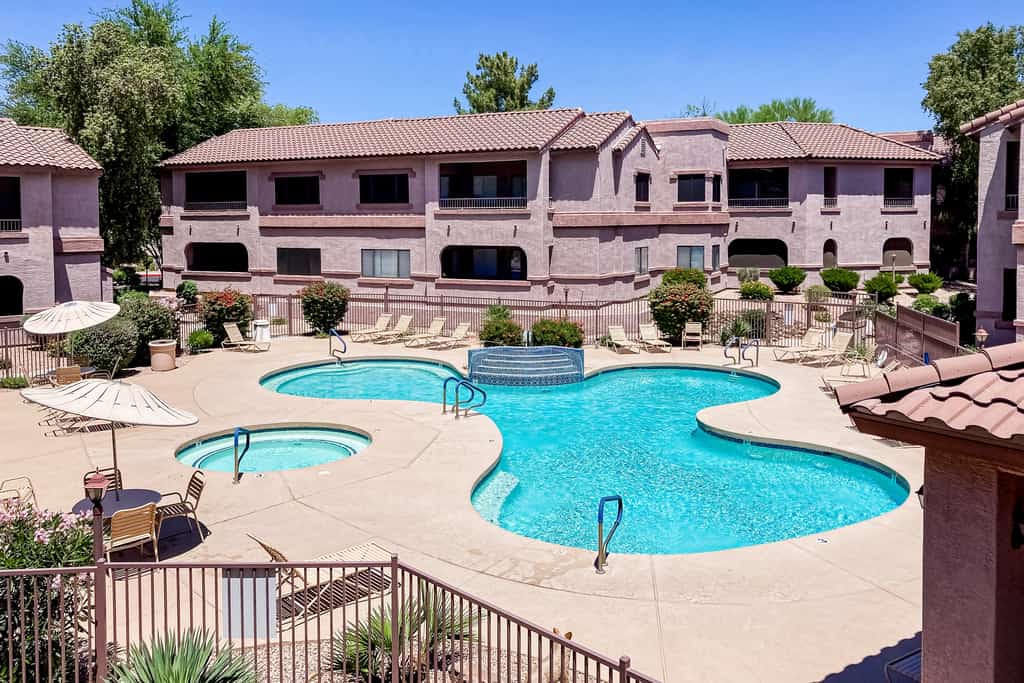 Second-floor condo with heated pool, hot tub, balcony, central AC & washer/dryer