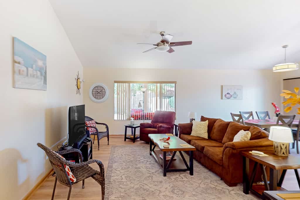 Mountain-view home with shaded patio, large yard, on-site golf & tennis