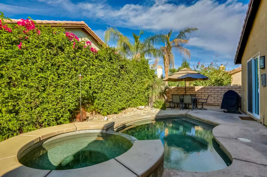 Classic, dog-friendly home near golf with heated pool, enclosed yard & fireplace