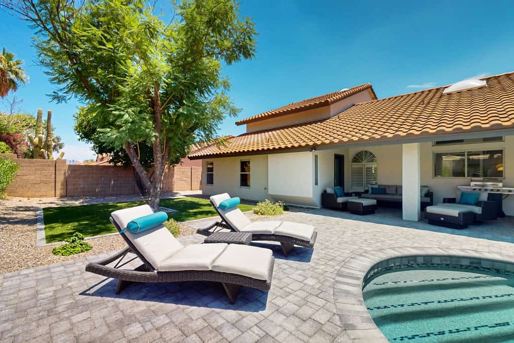 A stately luxury house with pool nestled in a serene neighborhood