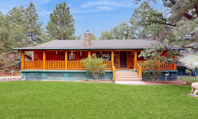 Two-story home with game room, large deck, bbq grill, & yard