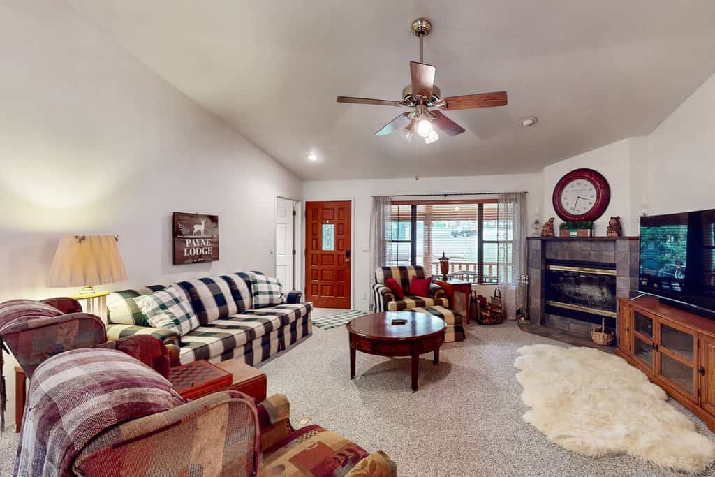 Two-story home with game room, large deck, bbq grill, & yard