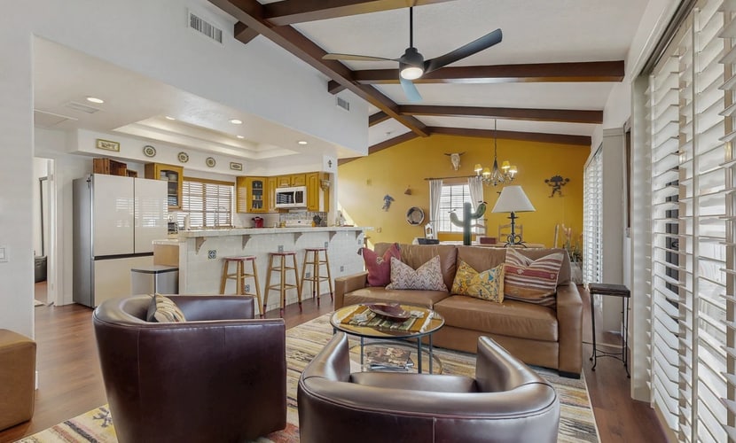 Palm-lined mountain view condo with heated pool, tennis, grill, fireplace, & AC