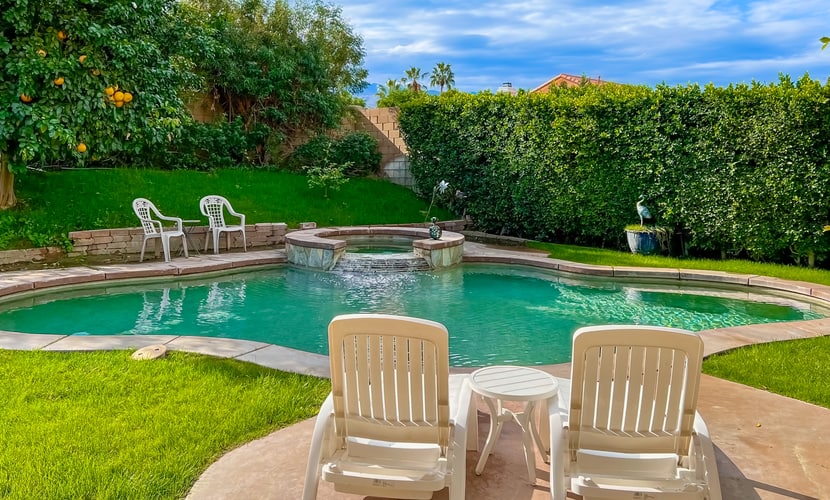 Expansive home with fireplace, heated pool & and spa in backyard haven