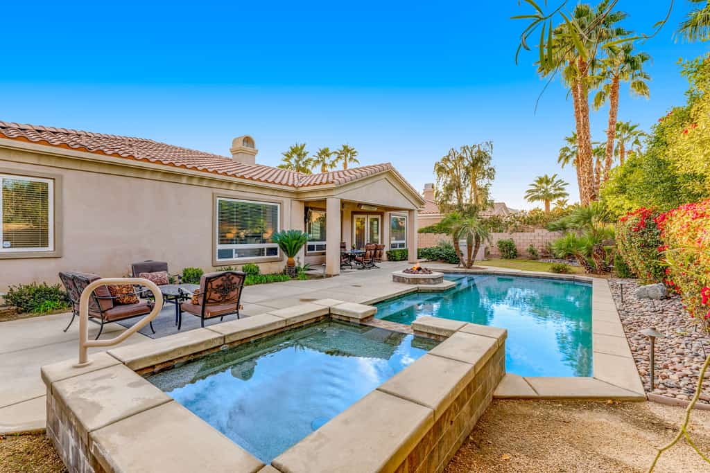 Dog-friendly desert style home with sprawling pool, pool spa, firepit & grill
