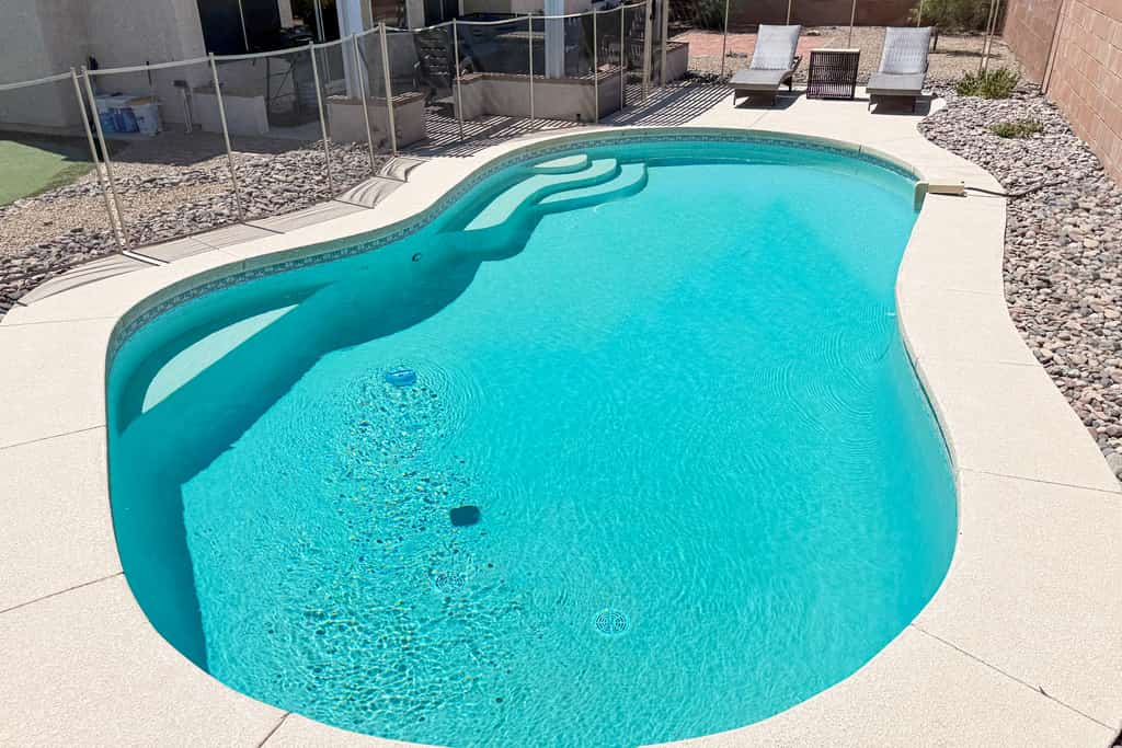 Sun-filled dog-friendly home with private pool, putting green, & mountain views