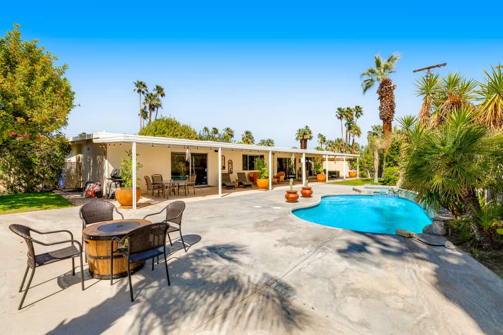 Mountain view home with a pool, pool spa, grill, firepit, washer/dryer, and AC