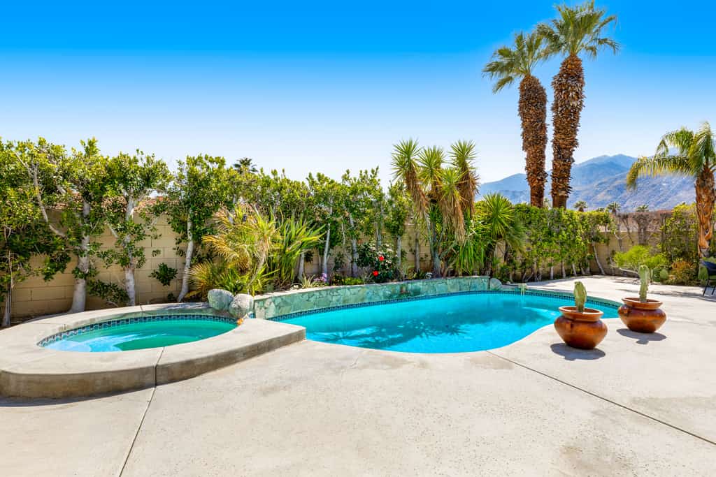 Mountain view home with a pool, pool spa, grill, firepit, washer/dryer, and AC