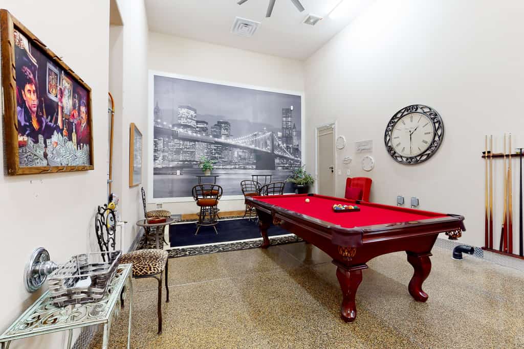 Luxe and spacious retreat with a pool, pool spa, firepit, grill, game room, & AC