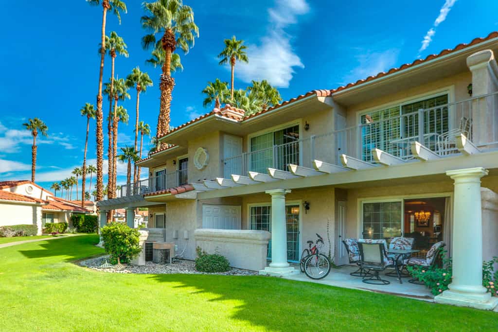 Eclectic dog-friendly condo with gated entrance, pool & grill