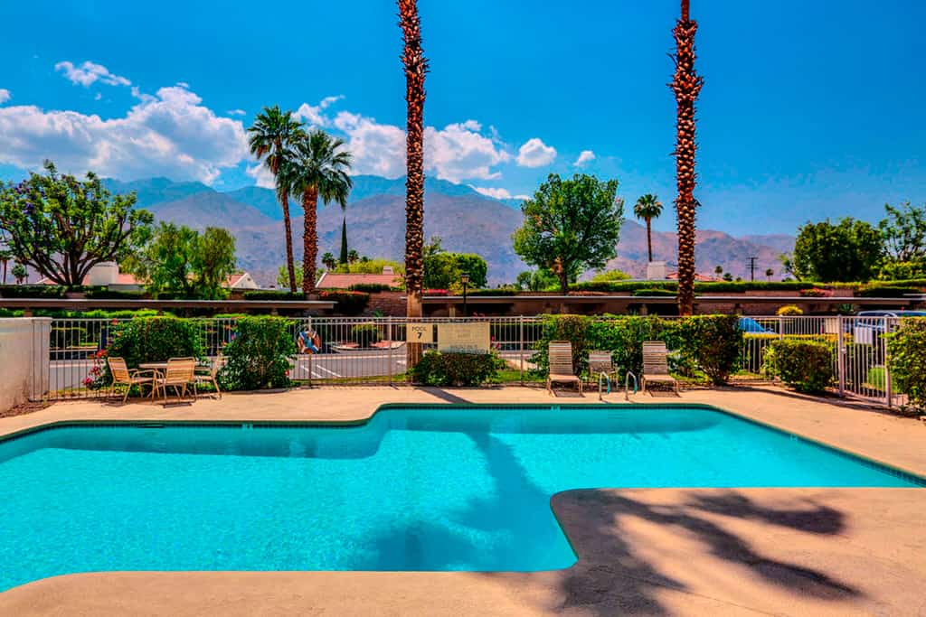 Eclectic dog-friendly condo with gated entrance, pool & grill