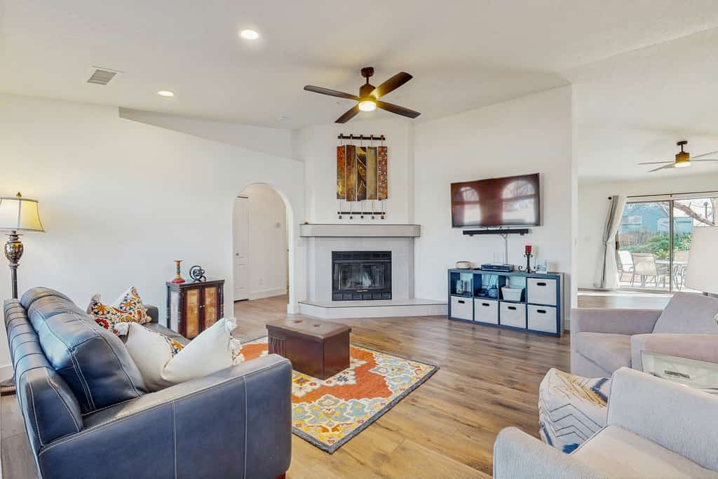 Dog-friendly home with garden patio, fireplace, & views of red rock cliffs