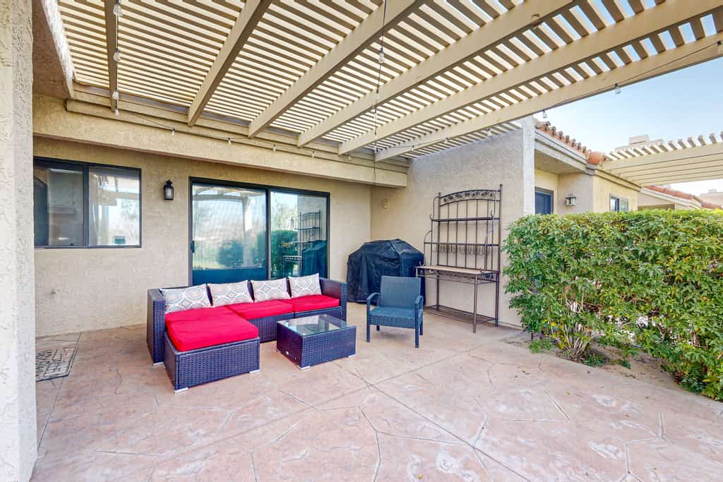 Water-view home on golf course with hot tub, pool, tennis, on-site golf, & patio