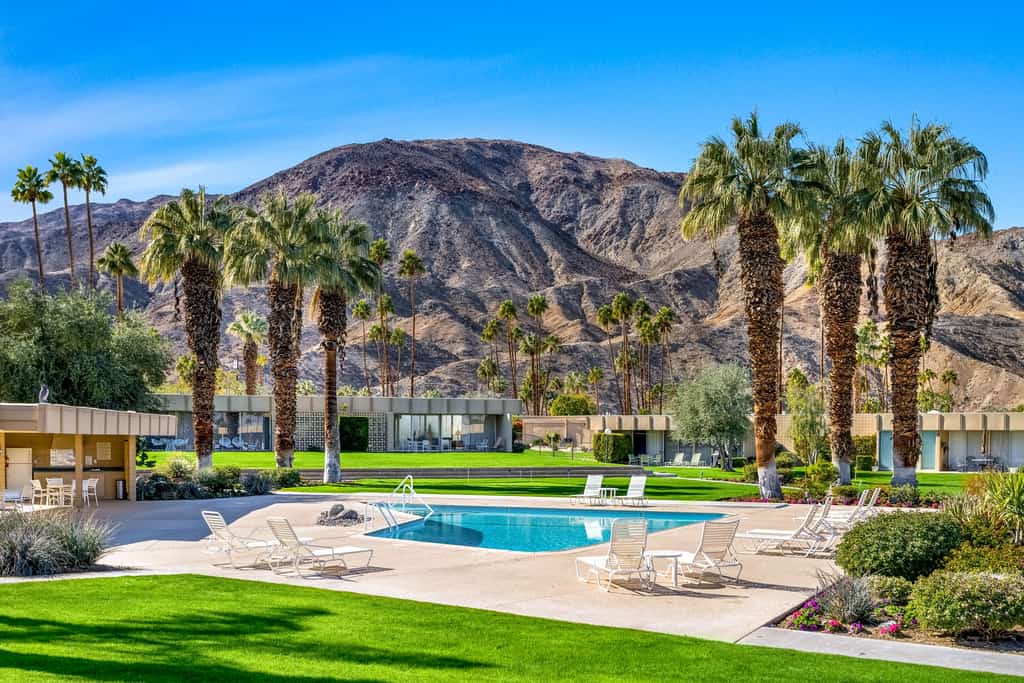Iconic mid-century modern home with on-site pool access, grill, AC, & W/D