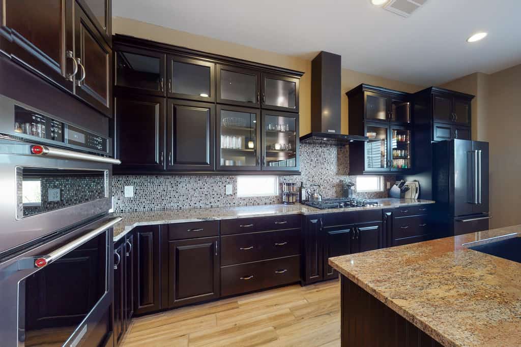 Southwestern stunner with enclosed yard, pool, putting green, & grill