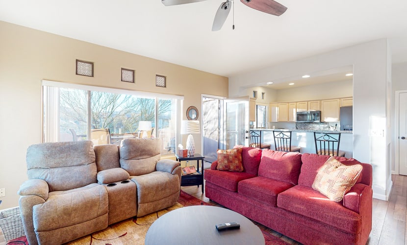 Sunny, dog-friendly condo with a heated pool, gym, grilling area, & golf nearby
