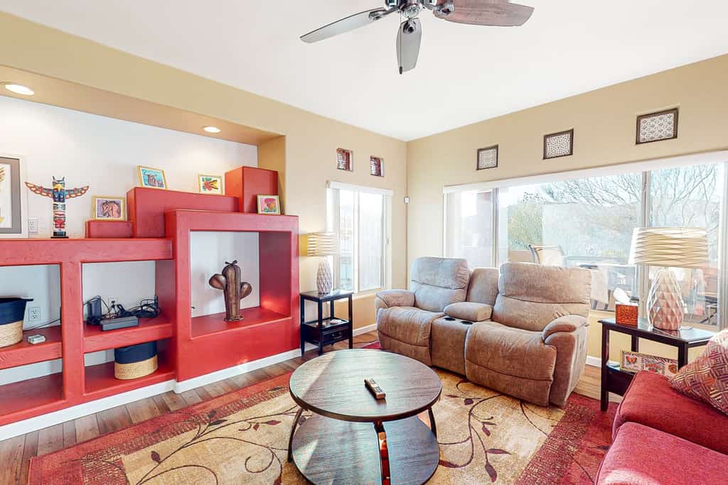 Sunny, dog-friendly condo with a heated pool, gym, grilling area, & golf nearby