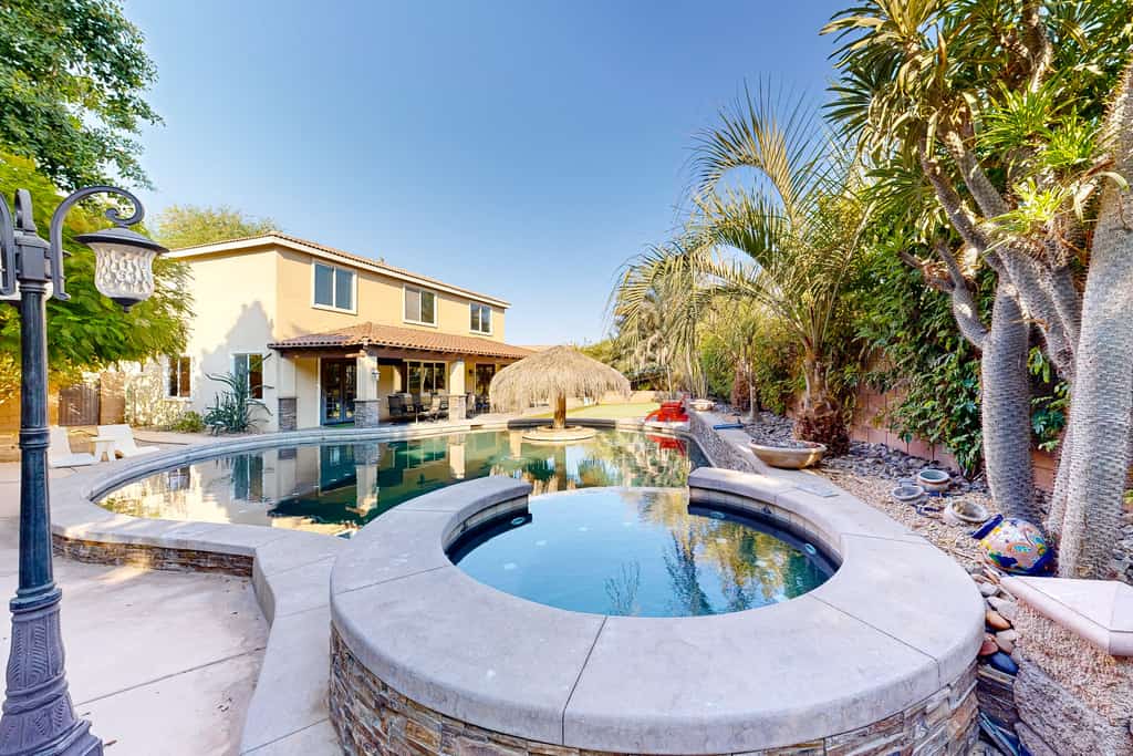 Beautiful home with private pool, outdoor kitchen & enclosed yard