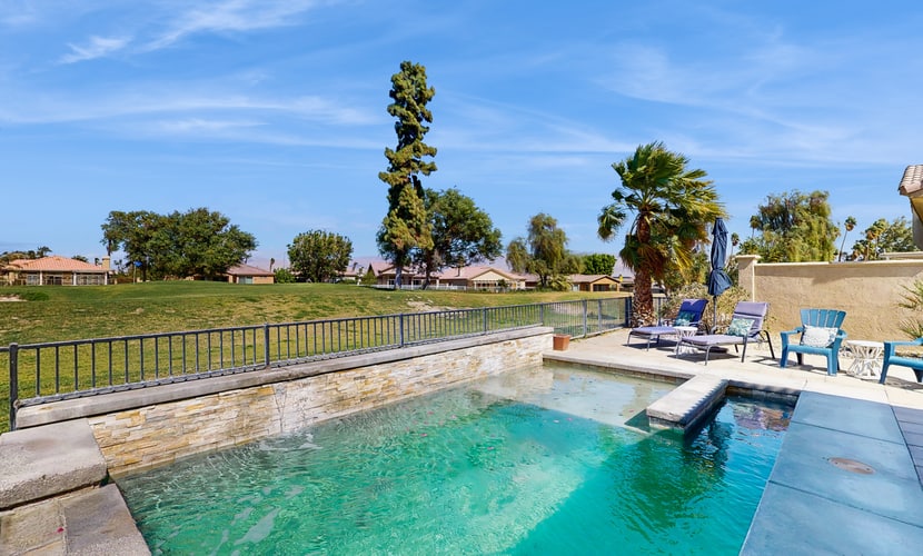 Dog-friendly golf course-adjacent home with a private pool, pool spa, & AC