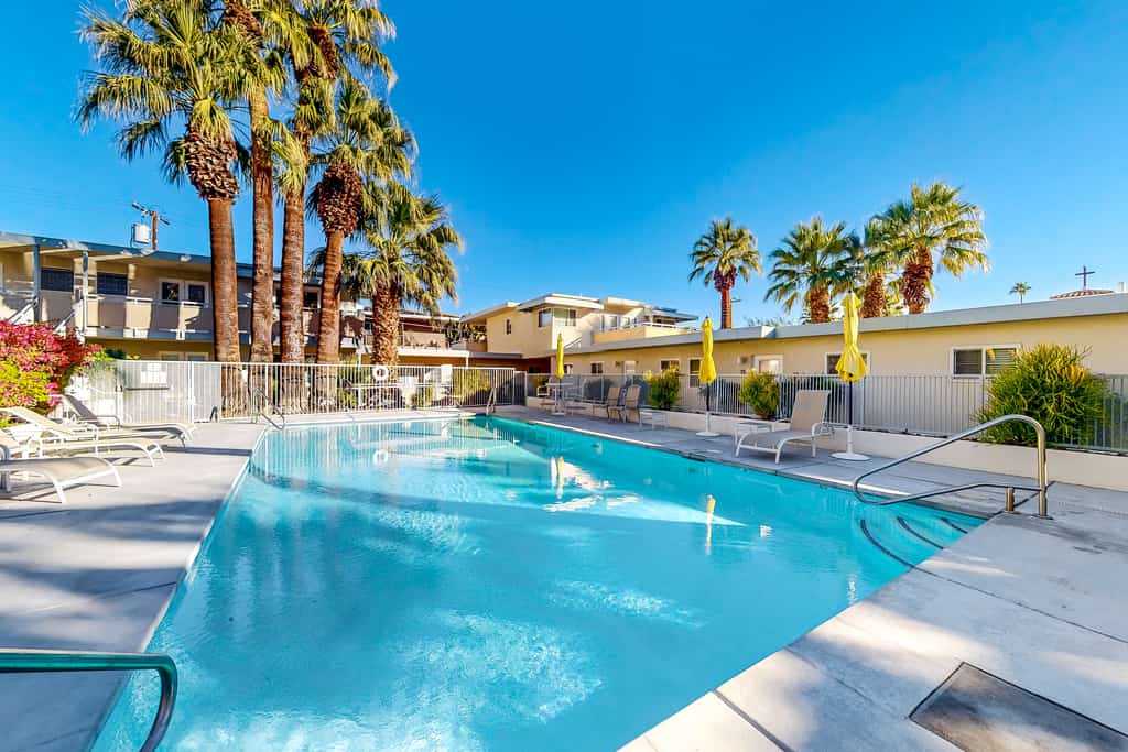 Mountain-view condo with pool, hot tub, balcony, & central AC