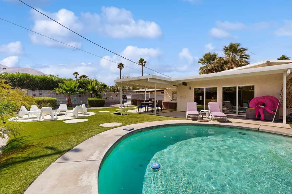 Mid-century oasis w/ circular heated pool, hot tub, & stunning mountain views