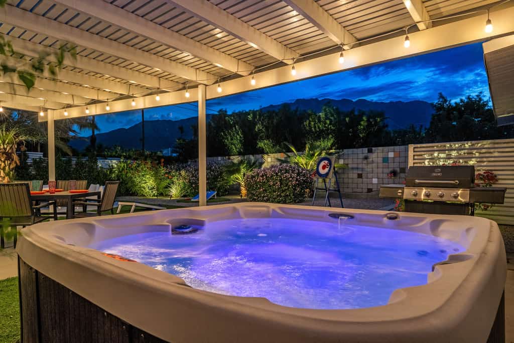 Mid-century oasis w/ circular heated pool, hot tub, & stunning mountain views