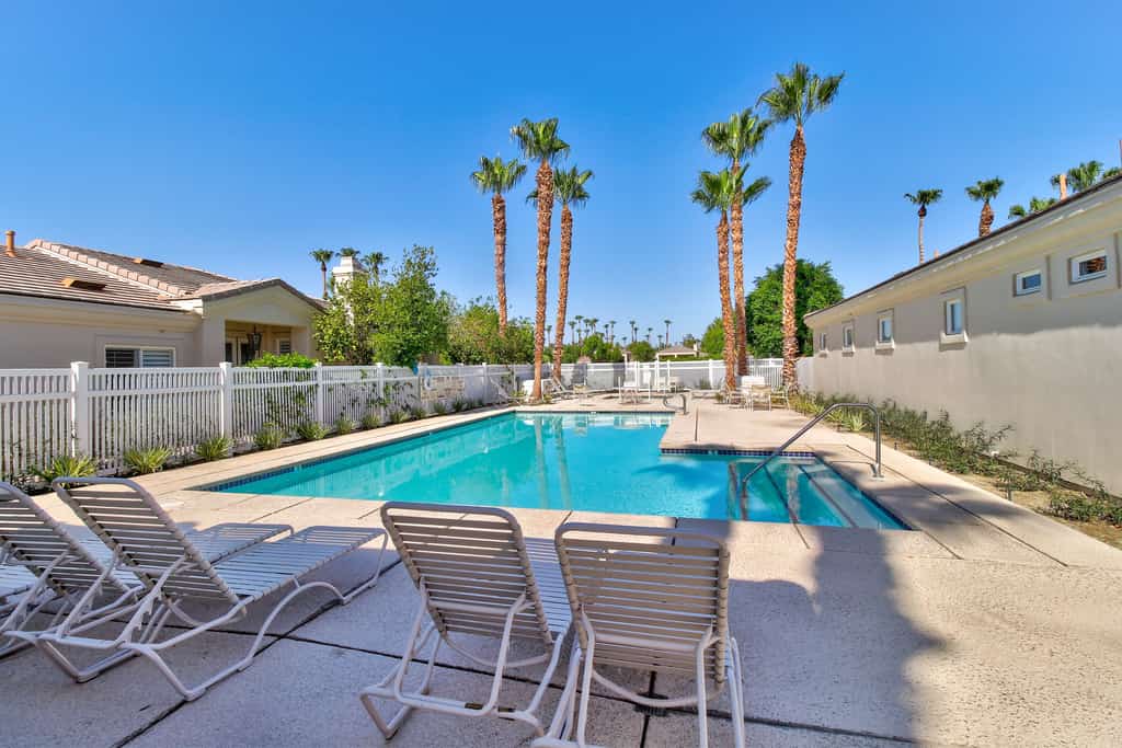 PGA West course-side house with shared pool, hot tub, and golf access