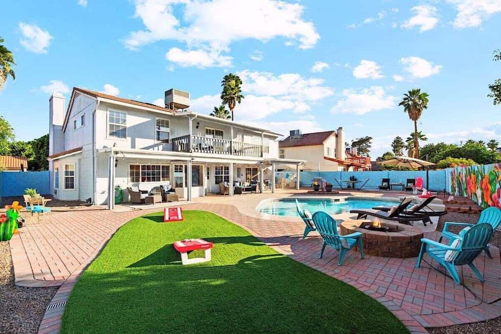 Fun-filled, modern home with game room, heated pool, hot tub, grill