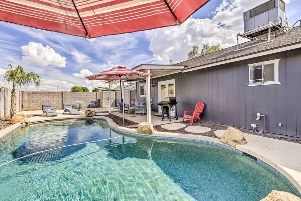 Single-level dog-friendly home with private pool, grill, enclosed backyard, & AC