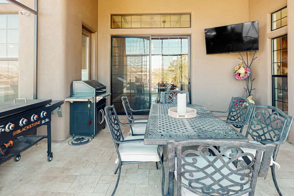 Luxury home with a pool, spa, fireplace, & private gas grill