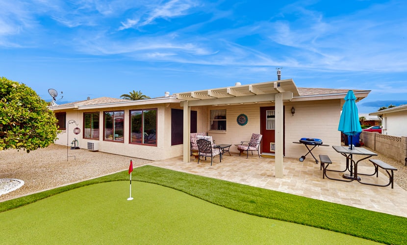 Sunny home with covered patio, grill, pool, tennis, hot tub, full kitchen, & AC