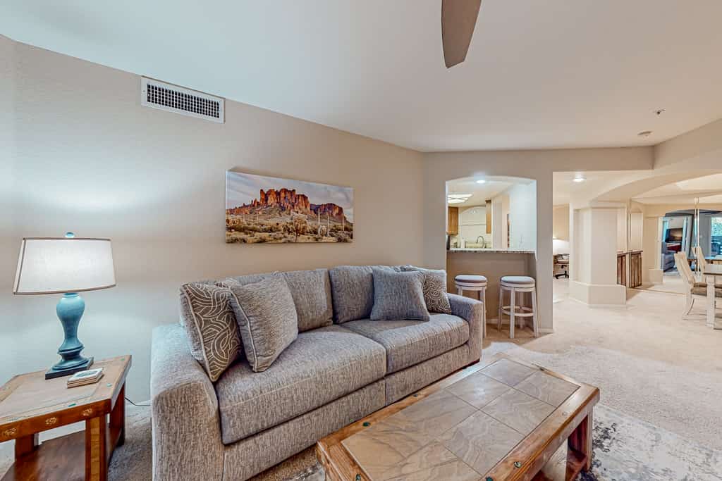 Inviting mountain-view condo with balcony - hot tub, heated pool & golf on-site
