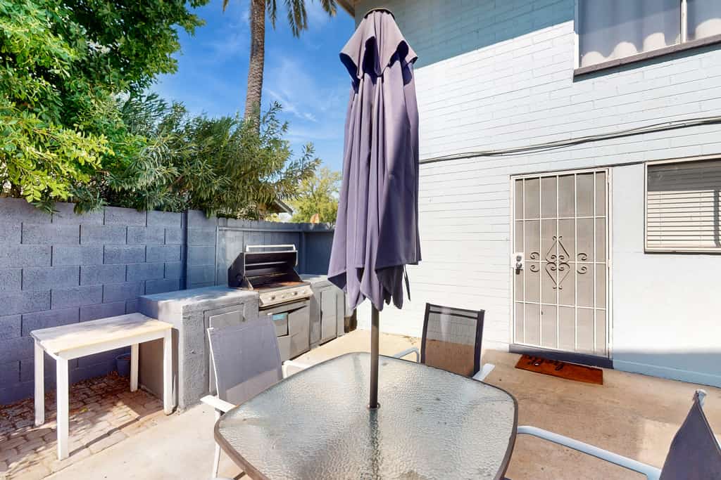 Dog-friendly condo near attractions with fenced yard, central AC, and cute decor