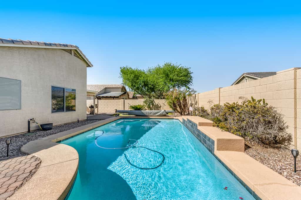 Spacious home with private heated pool with waterfall, putting green & firepit